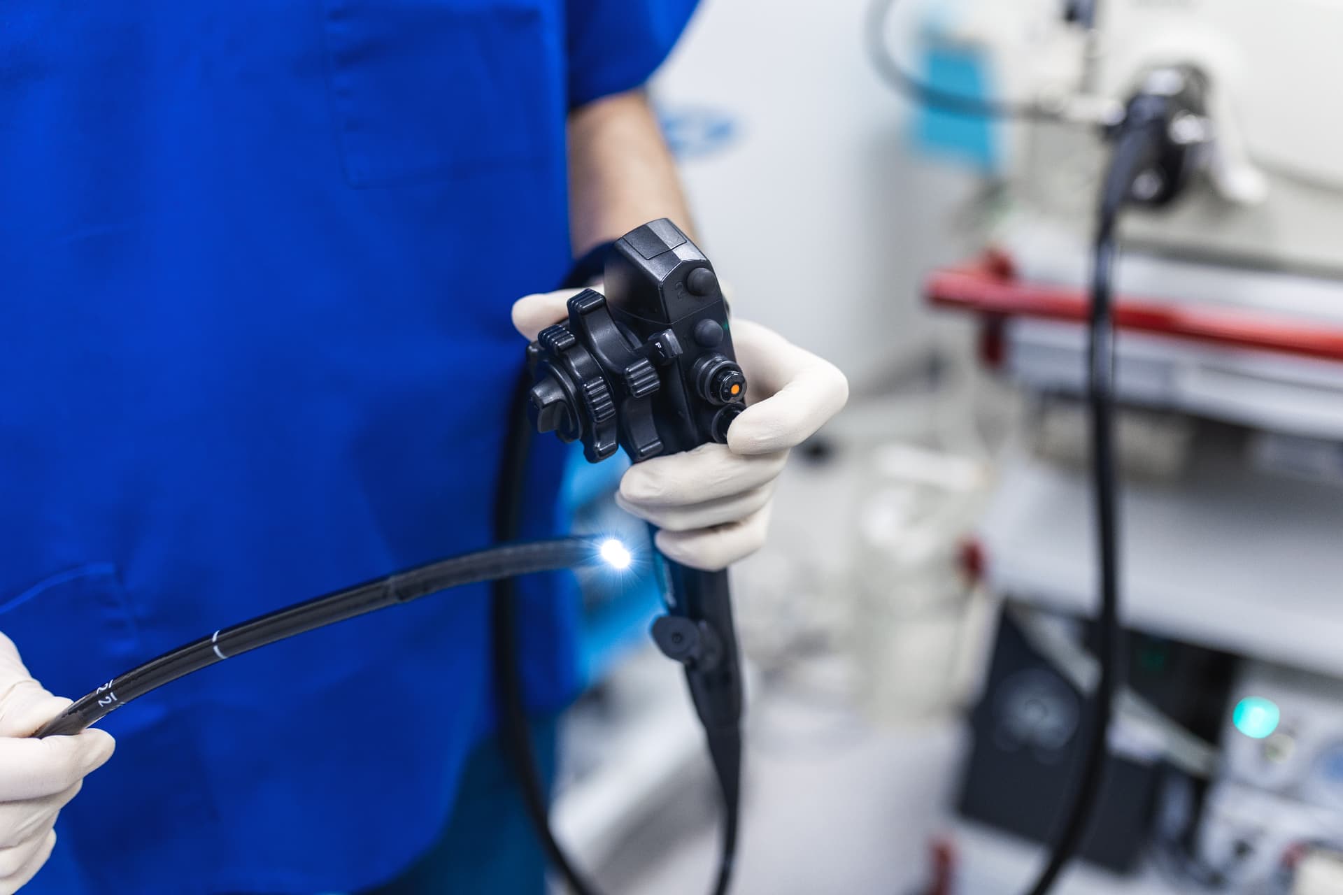 Upper GI endoscopy (OGD) procedure diagram showing endoscope examining the oesophagus and stomach